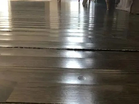 Oak strip flooring cupped and buckled after soaking up water